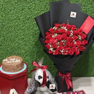 Red bouquet with cake and teddy bear